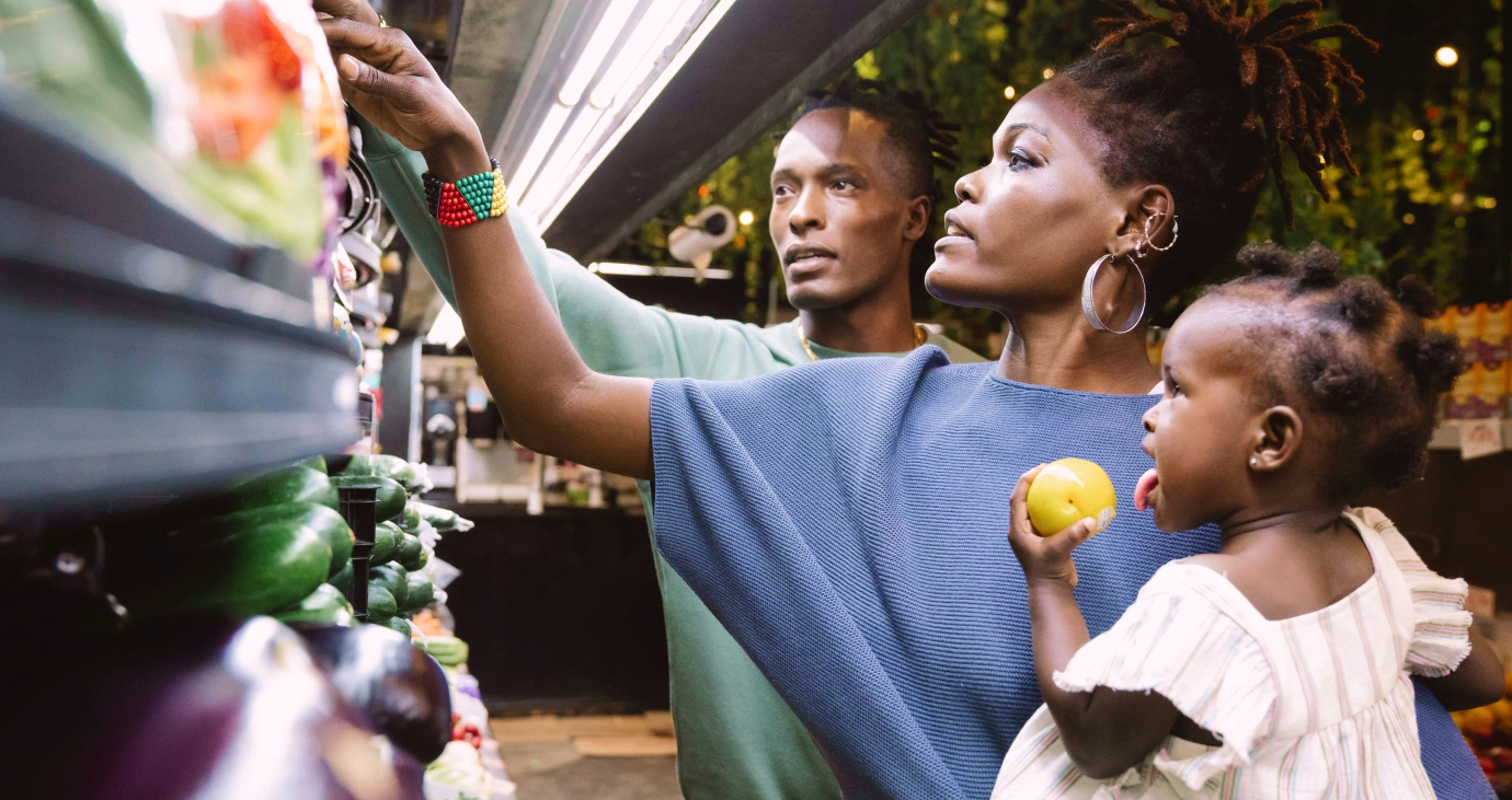 Food Policy Hub headline image of a family shopping for healthy food in a grocery store.